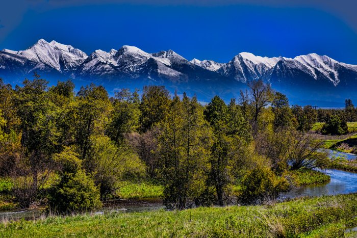 A snow-capped mountain range in Montana, USA.