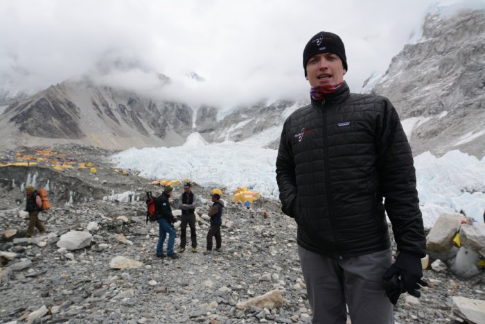 Global Rescue mountain rescue medic Dan Stretch standing on site in the Himalayas.