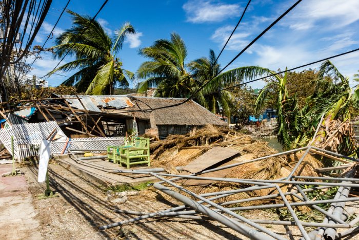 A house is almost completely destroyed after a super typhoon.