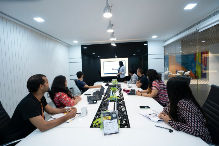 Business people in Delhi, India, meet in a conference room.