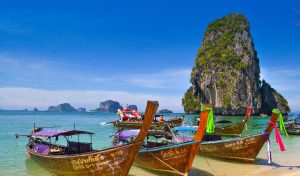 Traditional longtail boats on beach at Phuket, Thailand